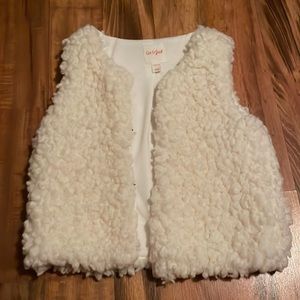 A fuzzy vest that has no sleeves, girls L, from Old Navy.